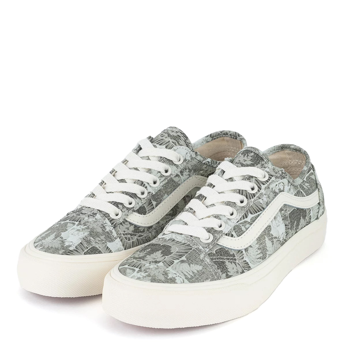 A green floral low-top Vans sneaker.