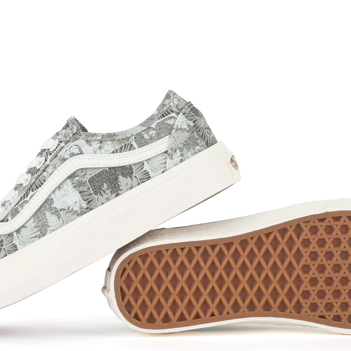 A green floral low-top Vans sneaker.
