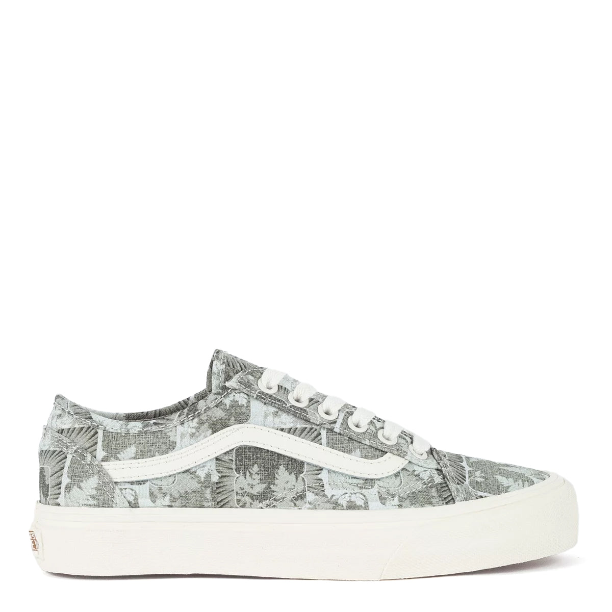 A green floral low-top Vans sneaker.