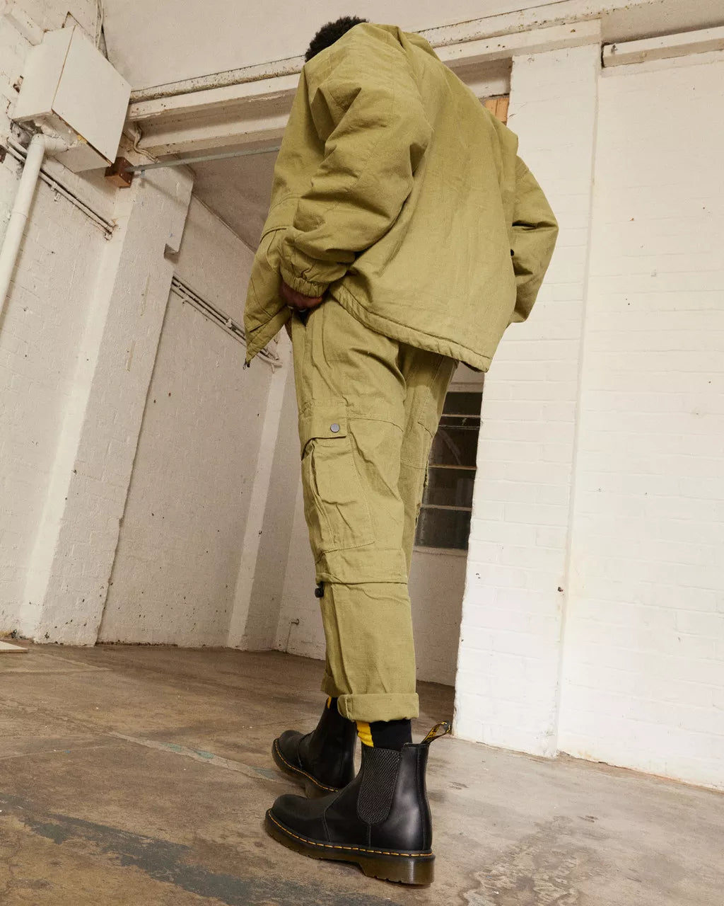 Demo of a pair of mid-ankle Dr. Martens black leather chelsea boots.