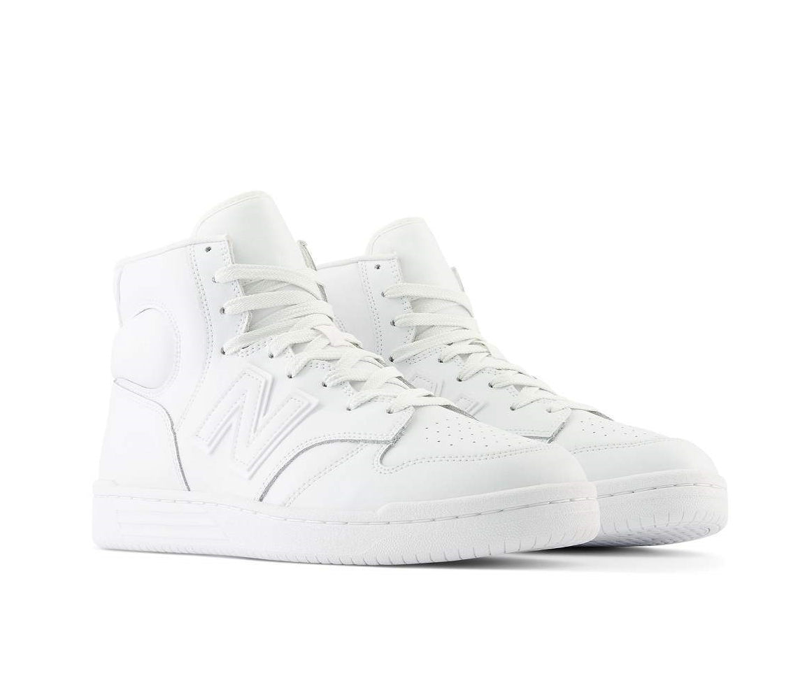 A monochrome white leather high-cut basketball sneaker from New Balance.