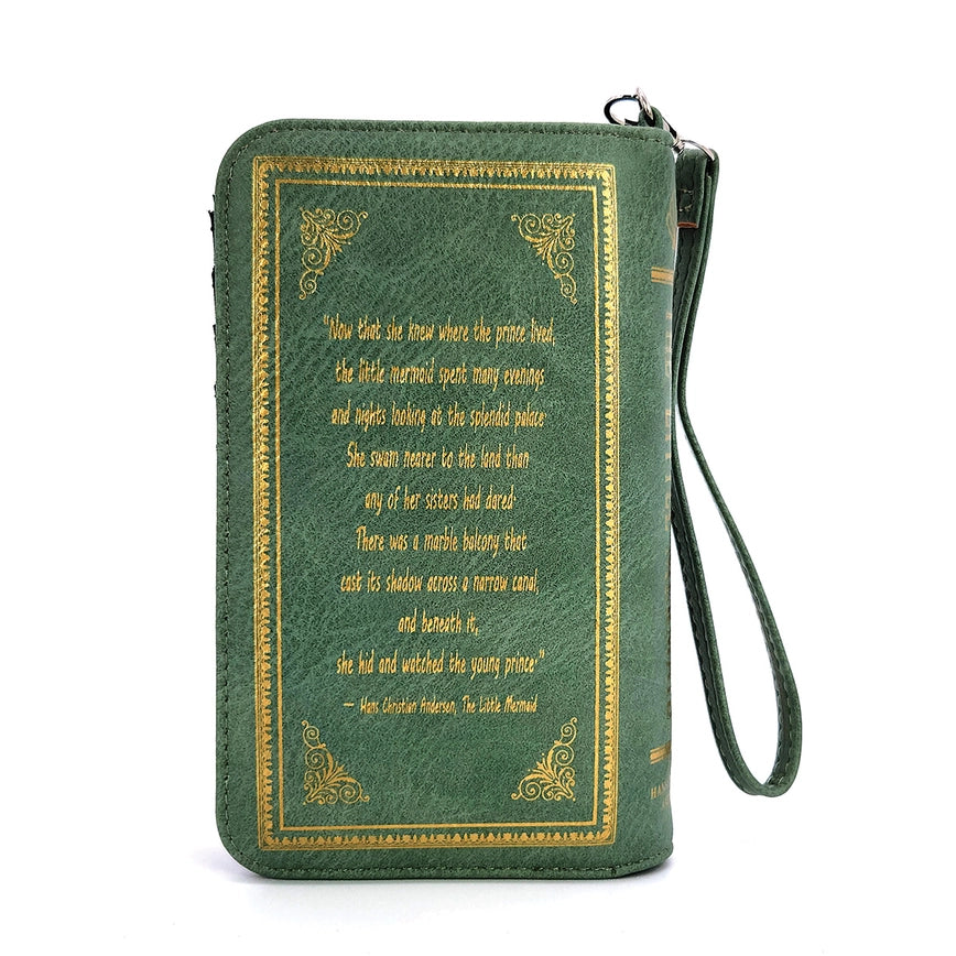 Back of a long, green wallet with a quote from Hans Christian Andersen's The Little Mermaid. It reads: "Now that she knew where the prince lived, the little mermaid spent many evenings and nights looking at the splendid palace. She swam nearer to the land than any of her sisters had dared. There was a marble balcony that cast its shadow across a narrow canal, and beneath it, she hid and watched the young prince."