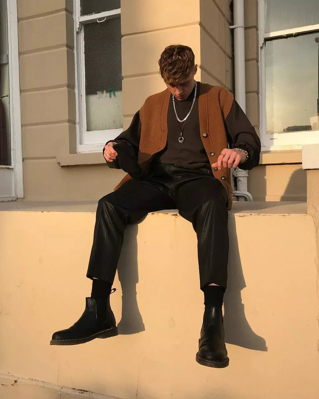 Demo of a pair of mid-ankle Dr. Martens black leather chelsea boots.