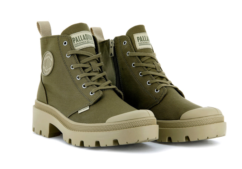 A green canvas boot from Palladium with tan accents.