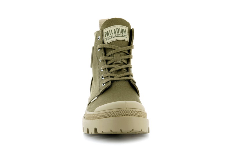 A green canvas boot from Palladium with tan accents.