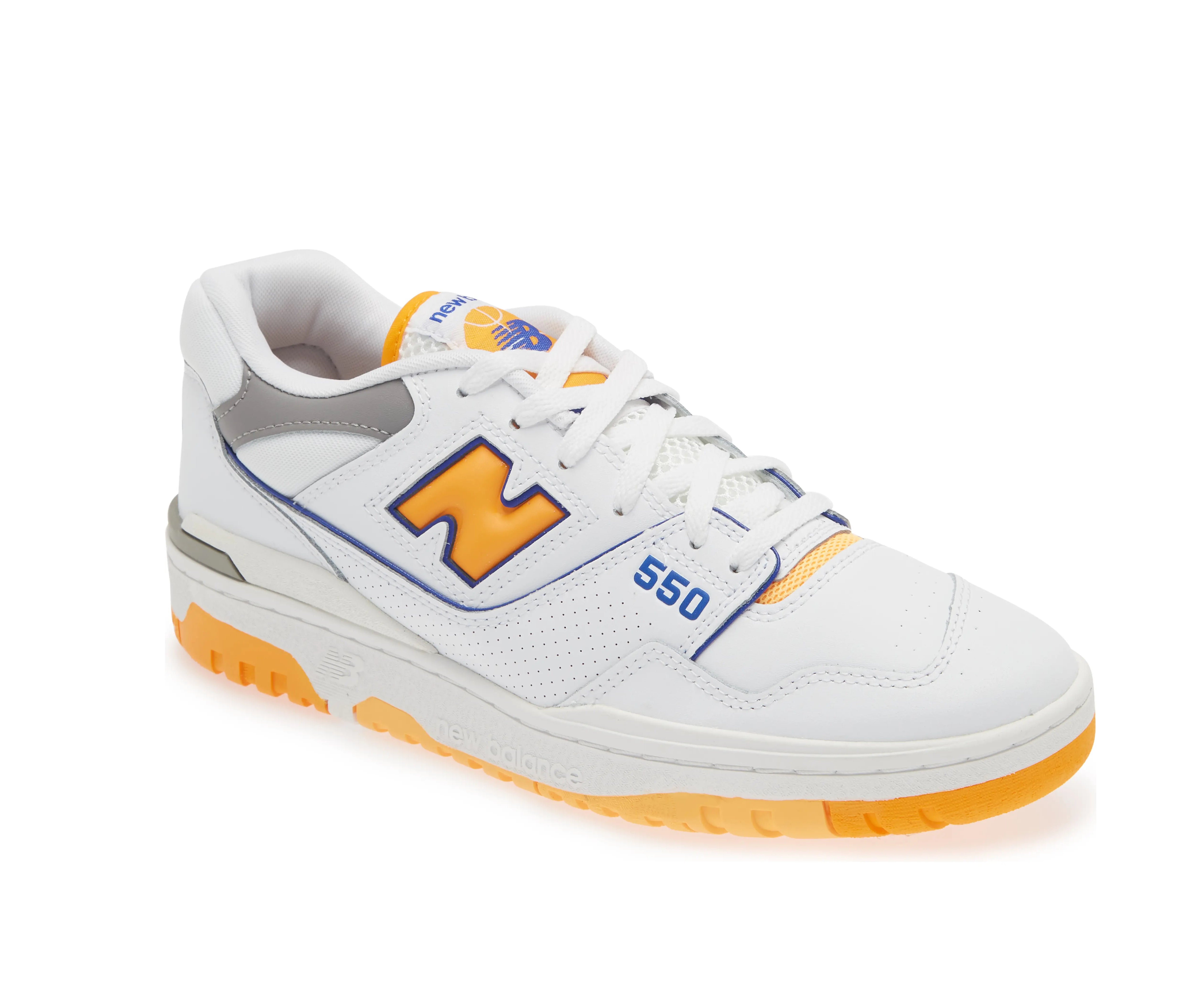 A white leather New Balance basketball shoe with orange and indigo accents.