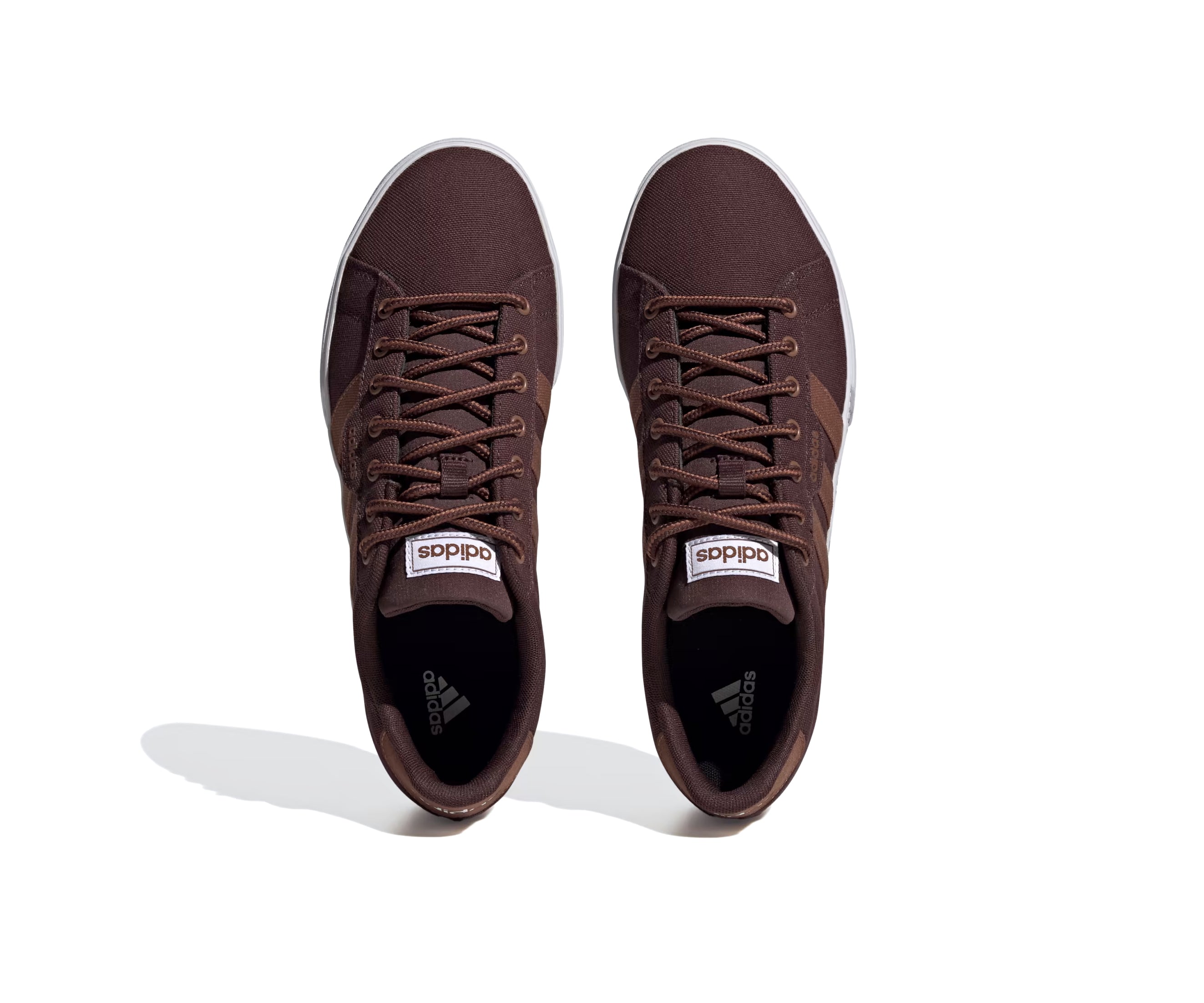 Brown canvas Adidas sneaker with lighter brown stripes and a white sole.