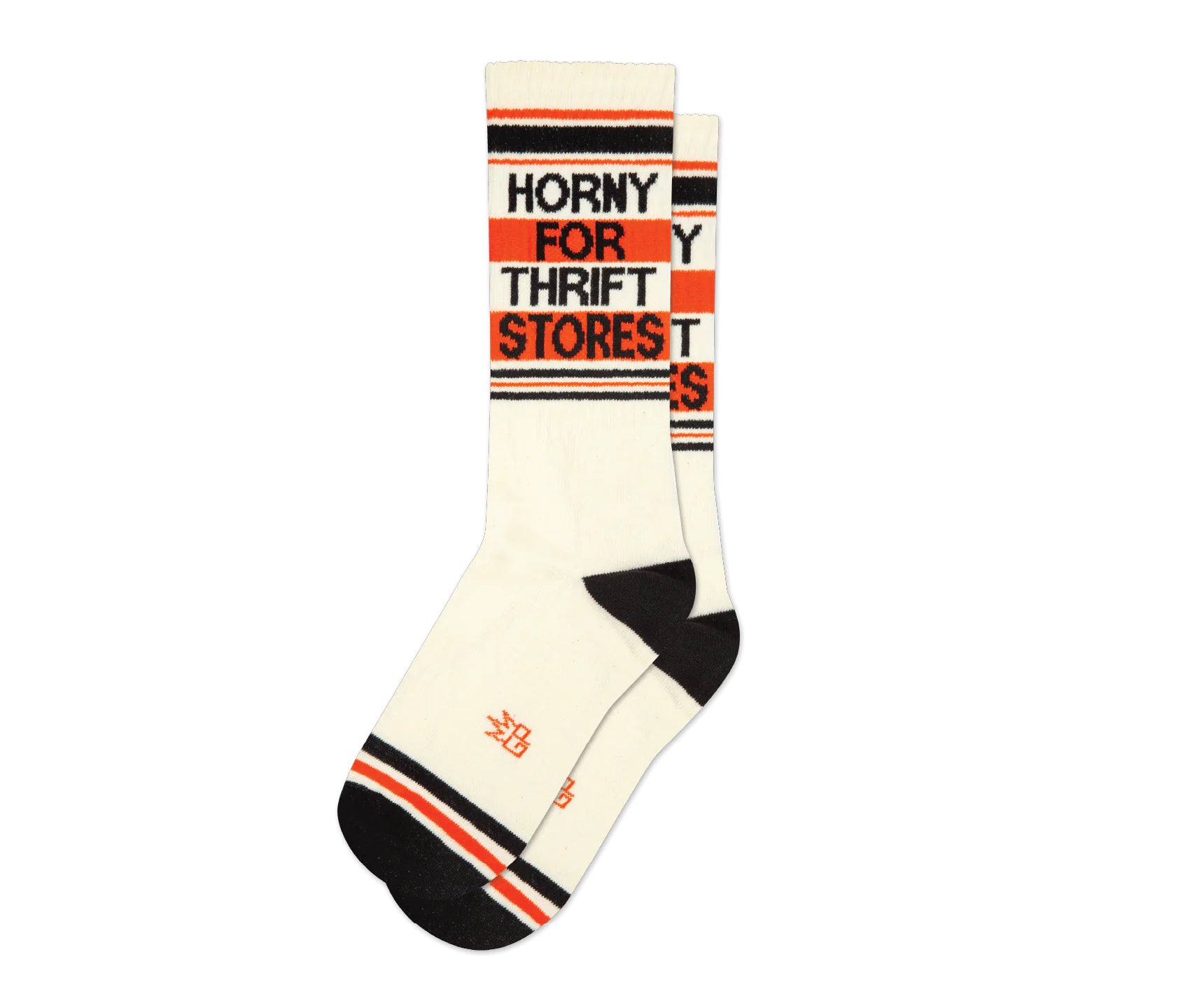 A pair of off-white and red crew socks that read "horny for thrift stores" with the Gumball Poodle logo on the arch.